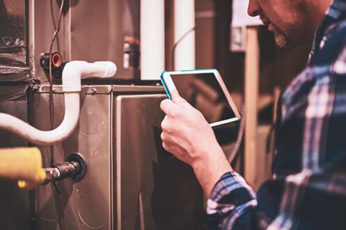 Homeowner Turning Off Furnace in Philadelphia, PA to Improve Energy Efficiency in the Summer